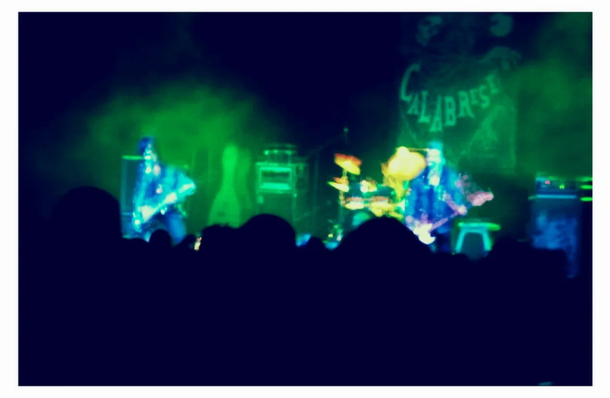 A rock band playing live on stage