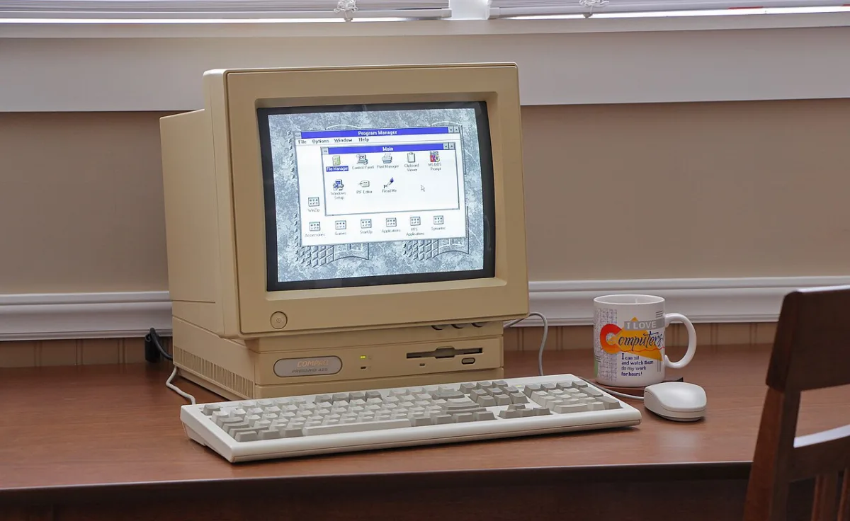 A beige Compaq Presario desktop computer from the early 2000s
