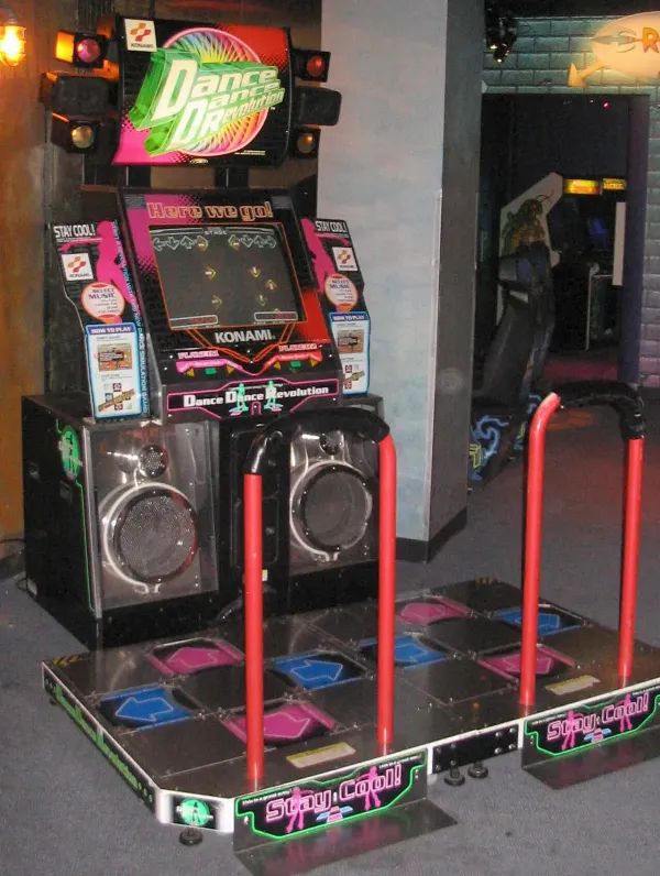 A Dance Dance Revolution arcade machine with two dance platforms