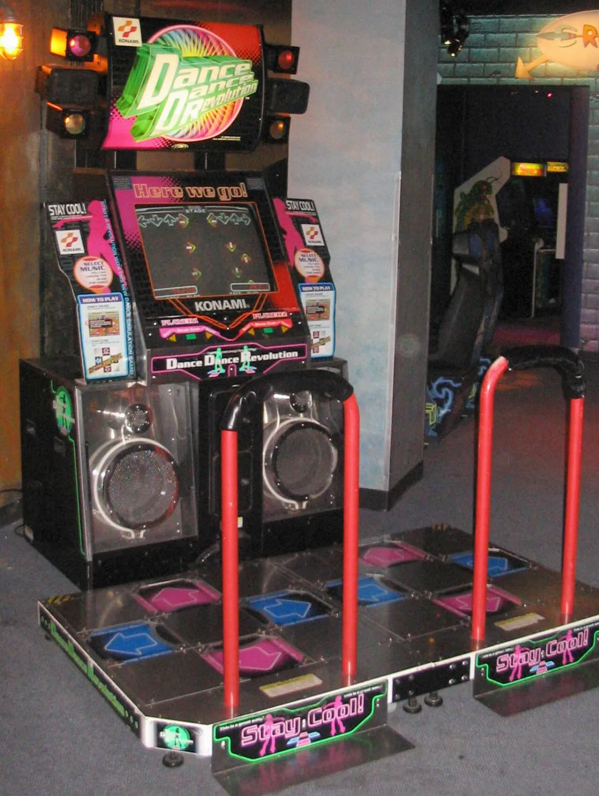 A Dance Dance Revolution arcade machine with two dance platforms