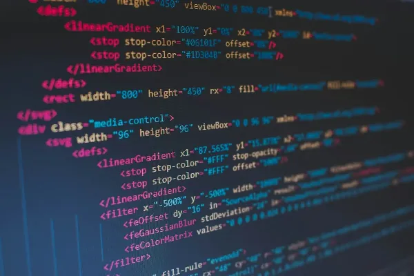 Lines of colorful HTML code on a dark computer screen