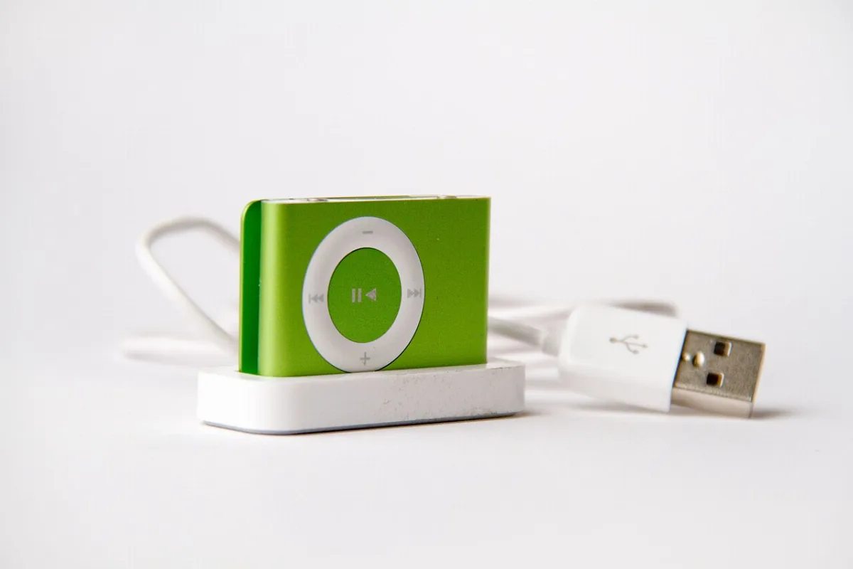 A green second generation iPod shuffle with a built-in clip