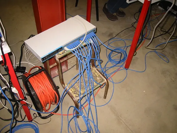 A room full of desktop computers set up for a LAN party