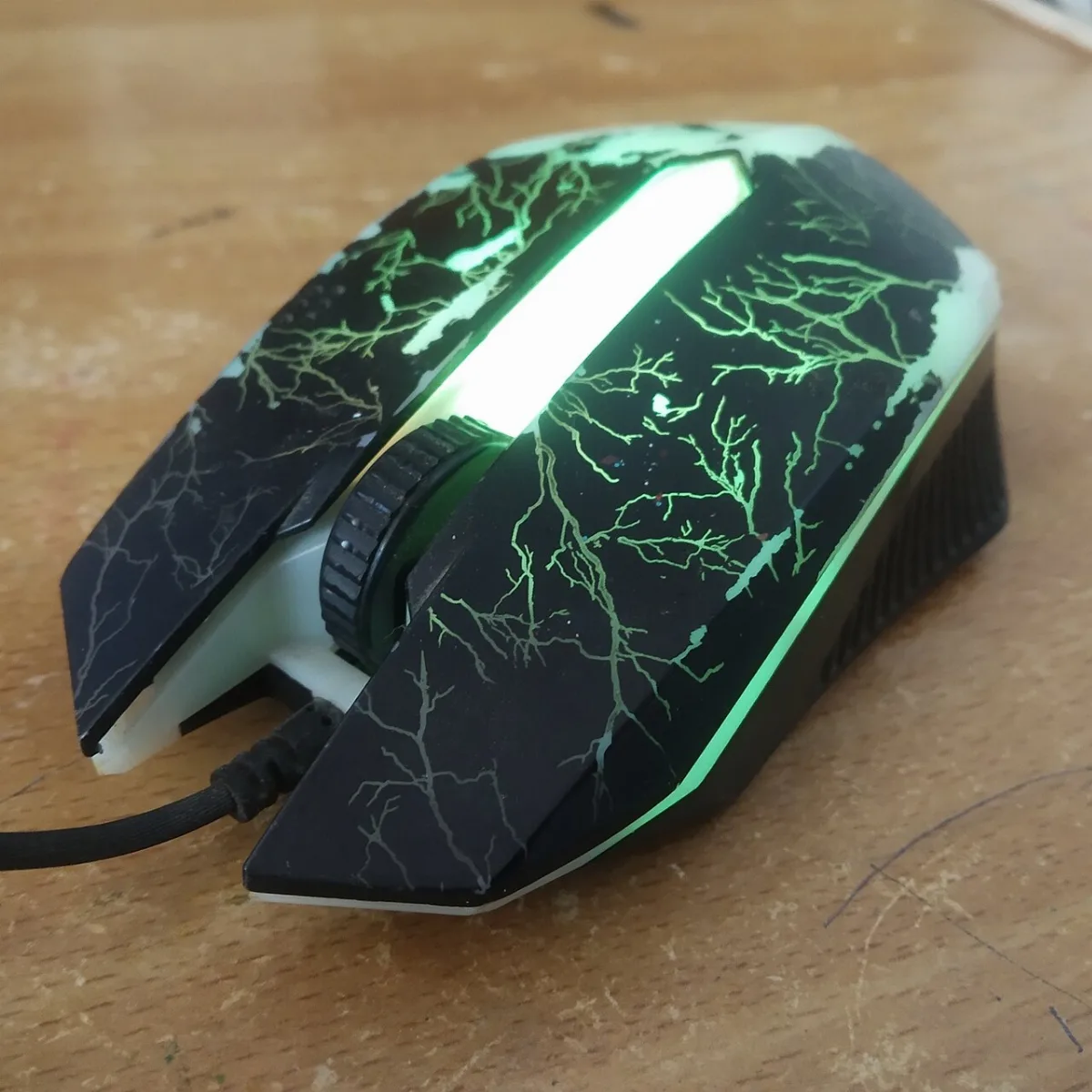 An old computer mouse on a desk
