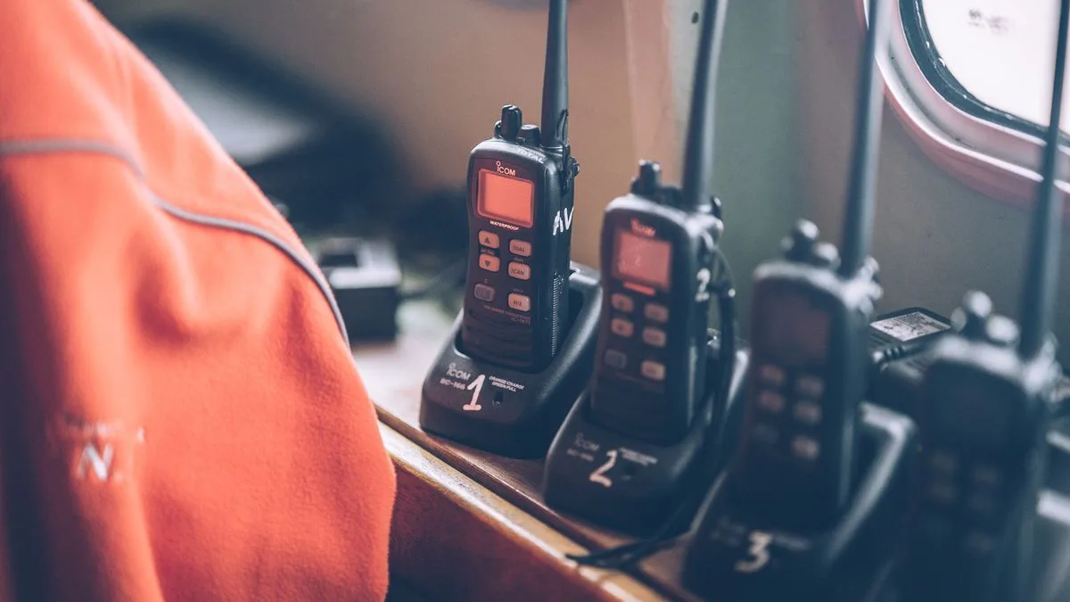 Two handheld walkie talkies up close