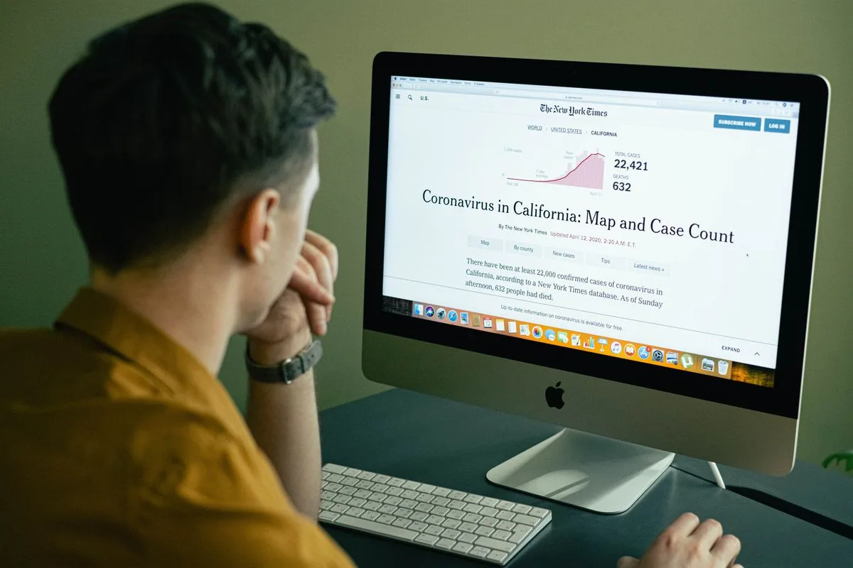 Someone reading a news site on a computer screen