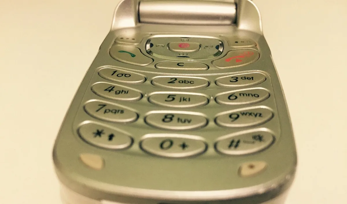The number keypad of a Samsung flip phone, with letters printed under each digit
