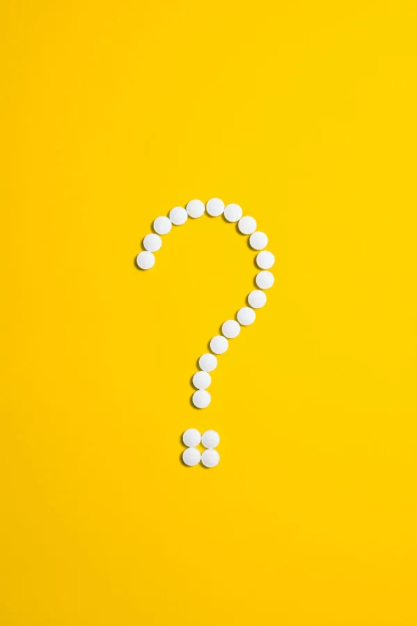 A question mark on a bright yellow background